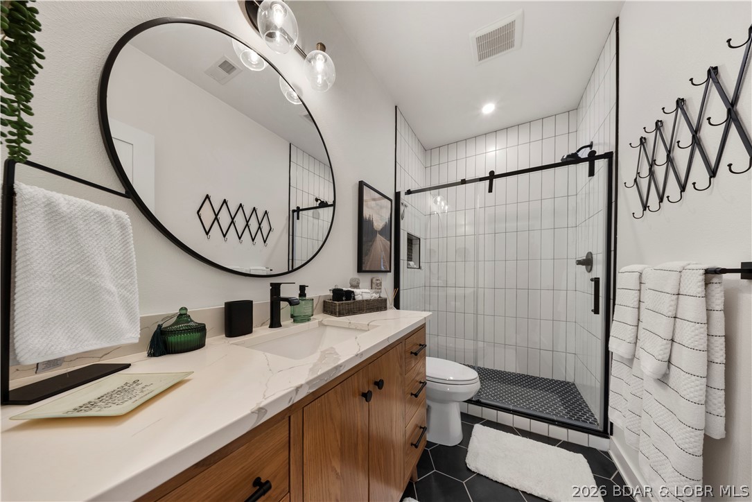 1151 Oak Road Osage Beach, MO 65065 - Photo 42 of 63 Modern bathroom featuring designer fixtures and el