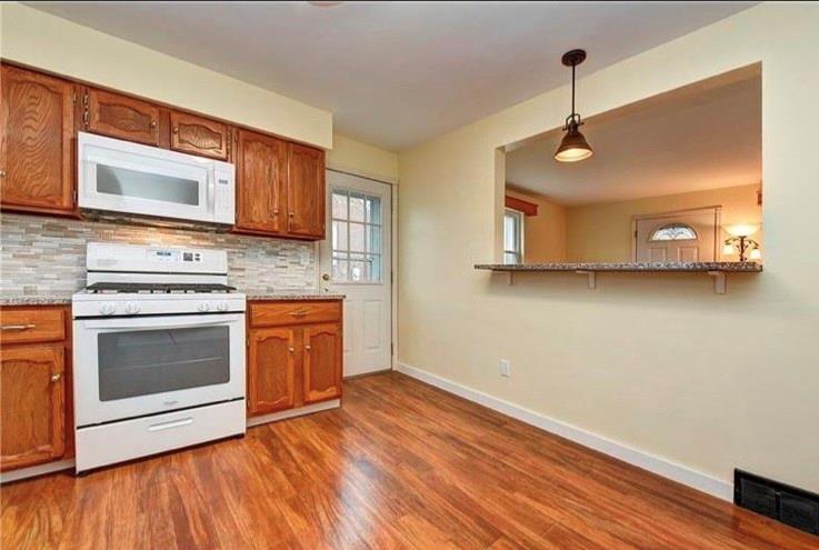306 Scene Ridge Road McKeesport, PA 15133 - Photo 8 of 19 Great granite breakfast bar open to the living area