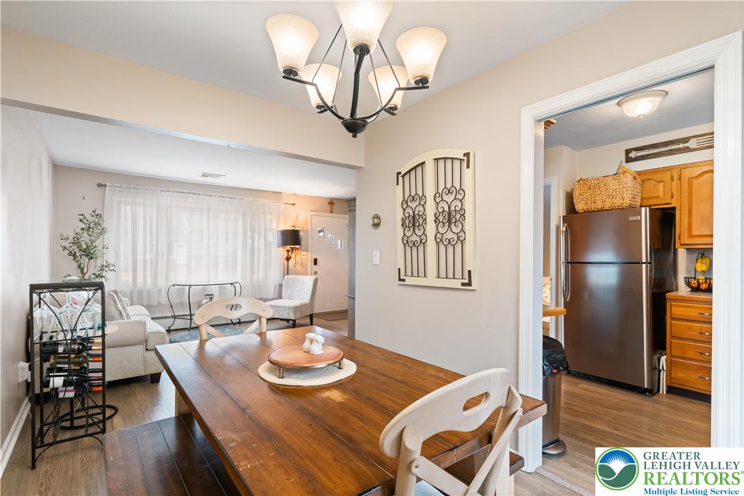 1937 Greenleaf Street Bethlehem, PA 18017 - Photo 18 of 45 a view of a dining room with furniture a chandelier and wooden floor