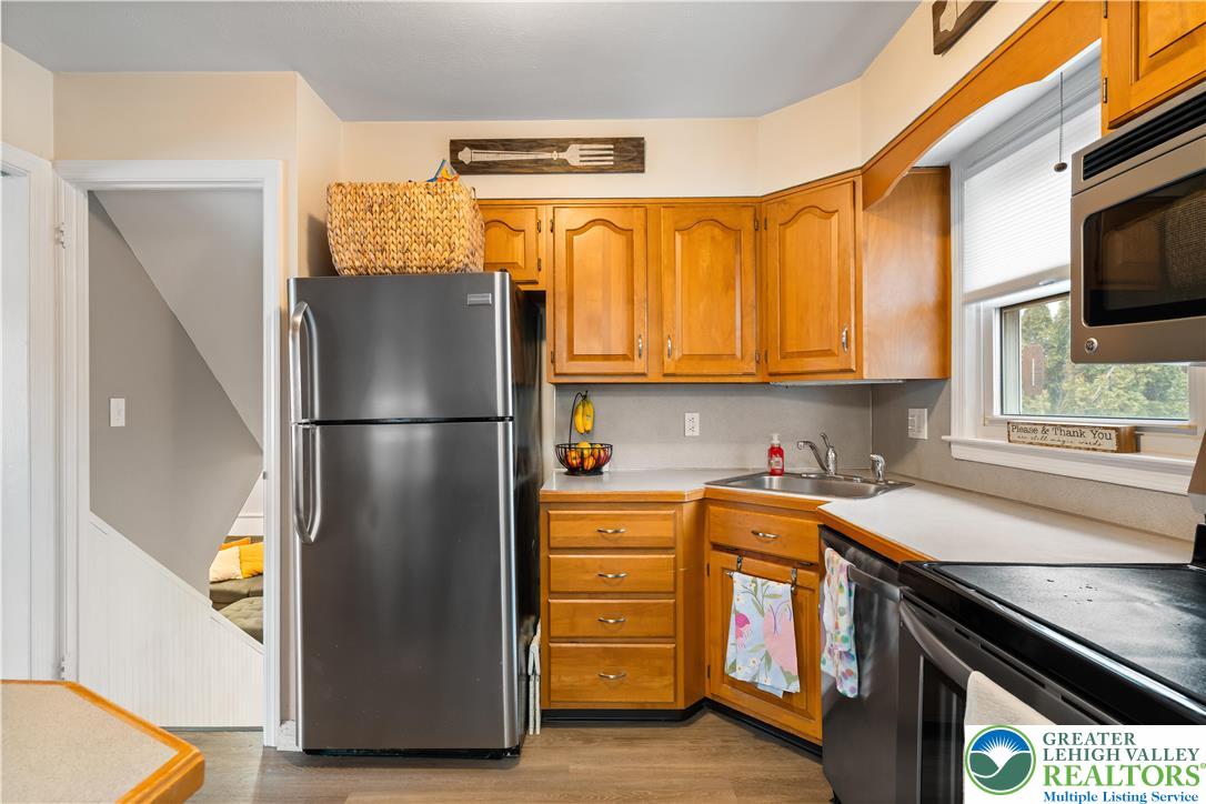 1937 Greenleaf Street Bethlehem, PA 18017 - Photo 19 of 45 a kitchen with stainless steel appliances granite countertop a refrigerator a stove a sink and a microwave