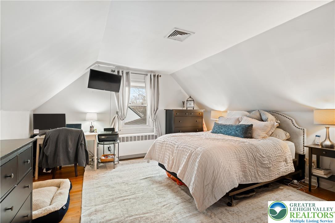 1937 Greenleaf Street Bethlehem, PA 18017 - Photo 32 of 45 a bedroom with a bed and wooden floor