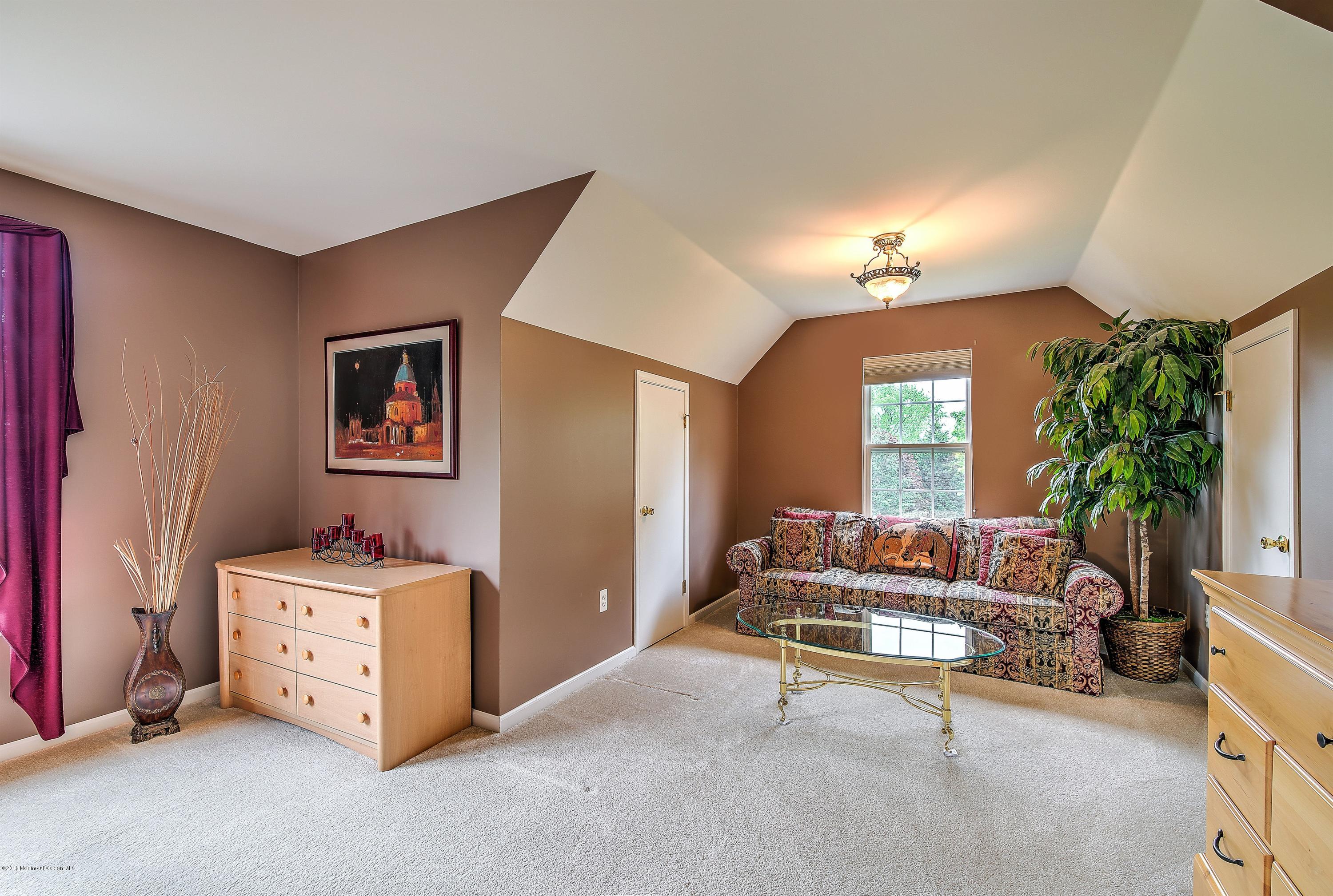 362 Jackson Mills Road Jackson, NJ 08527 - Photo 22 of 34 a living room with furniture and a chandelier