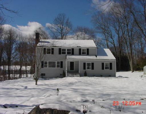 531 Belden Hill Road Wilton, CT 06897 - Photo 1 of 1 a front view of a house with a yard
