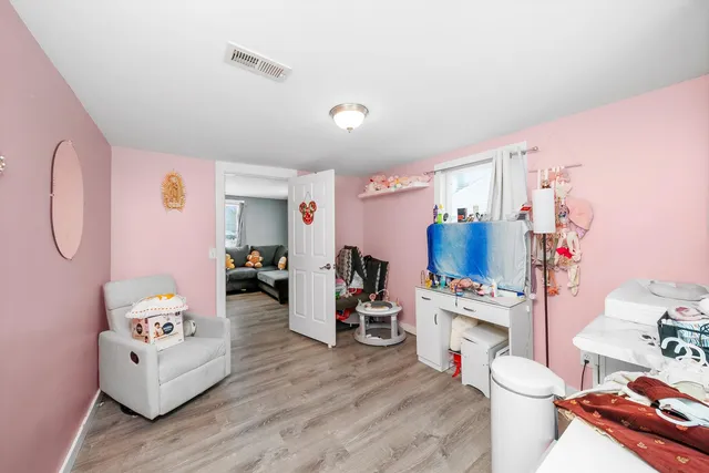 a bathroom with a sink mirror and toilet