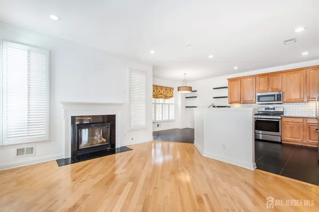 a view of kitchen with wooden floor