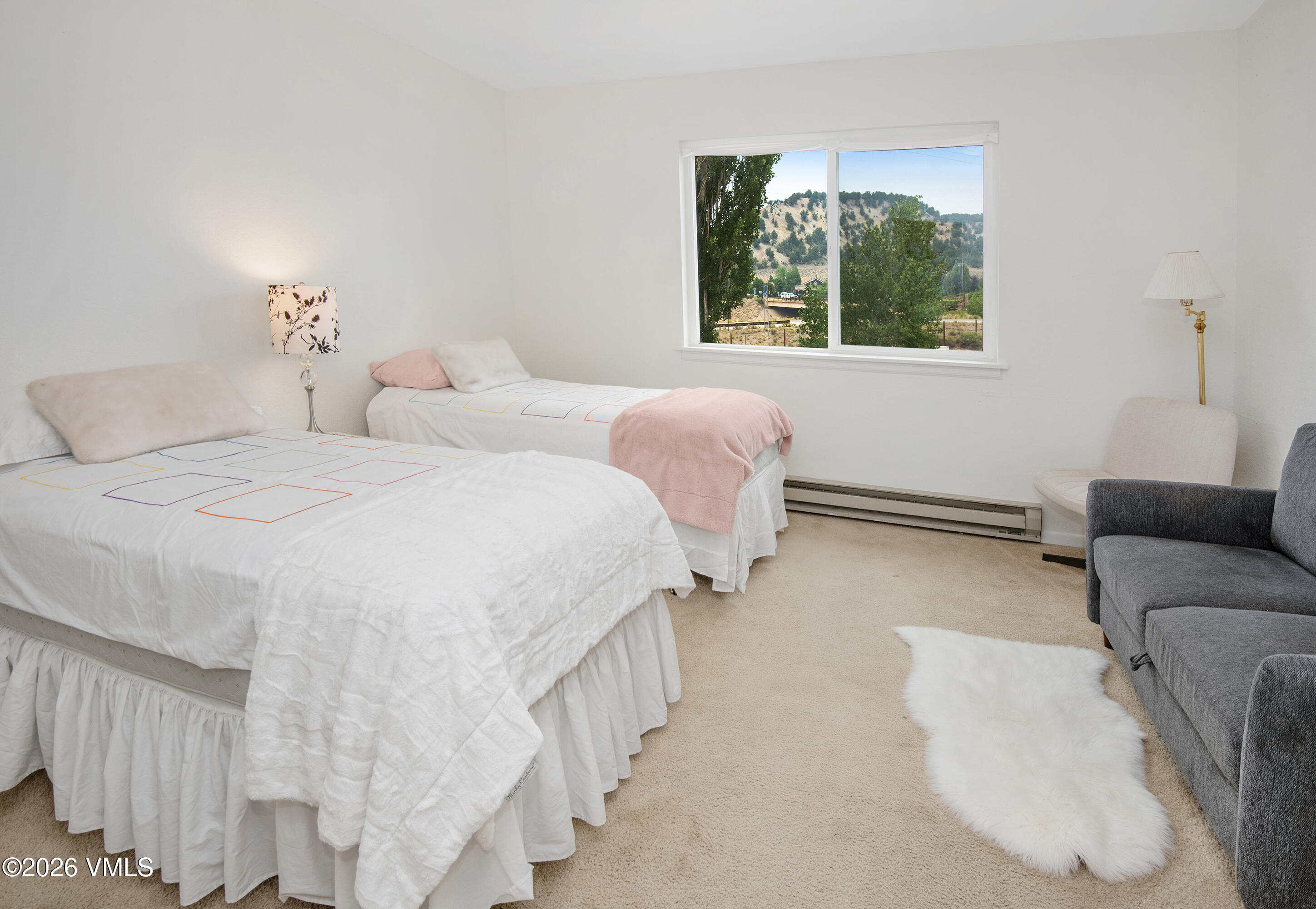 85 Chambers Avenue, Unit 10 Eagle, CO 81631 - Photo 18 of 41 a spacious bedroom with two beds and a window