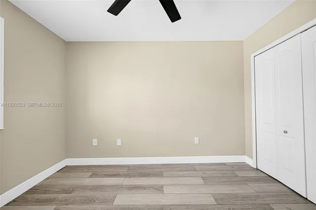 an empty room with windows and entrance