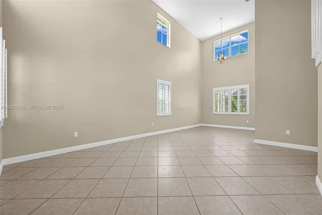 a view of livingroom with hardwood floor and a ceiling fan