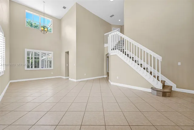 a view of an empty room with a fireplace