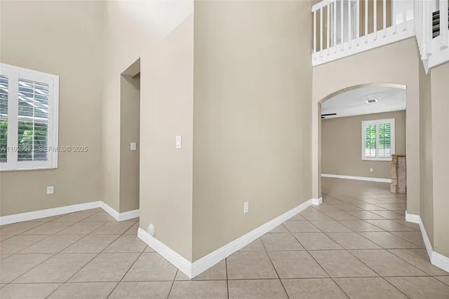 a kitchen with stainless steel appliances granite countertop a stove top oven a sink dishwasher and a refrigerator