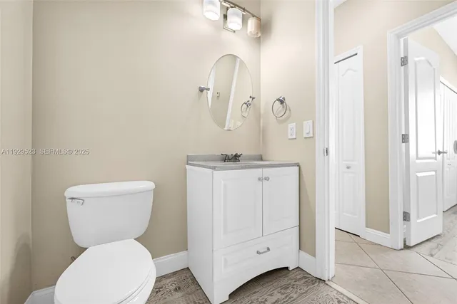 a bathroom with a shower sink and mirror