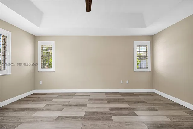 a view of a brick house with plants