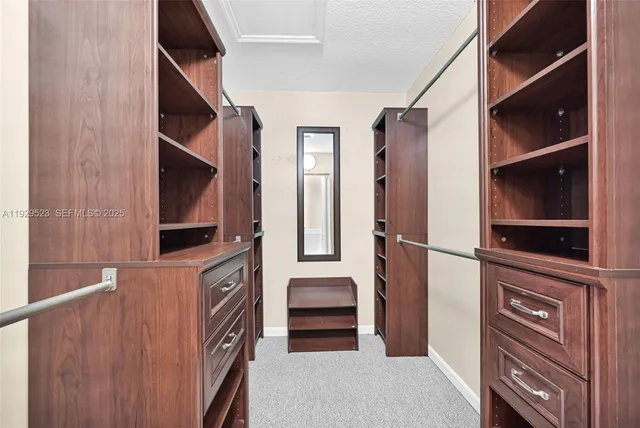 a view of an house with backyard space and balcony