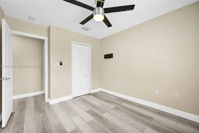 an aerial view of a houses with a swimming pool