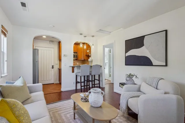 a bedroom with a large bed and a couch