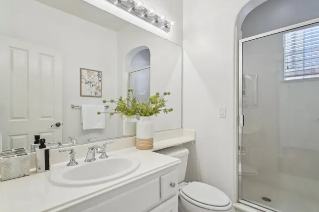 a spacious bedroom with a bed and a window