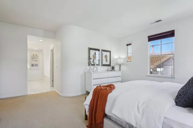 a view of a balcony with flower plants