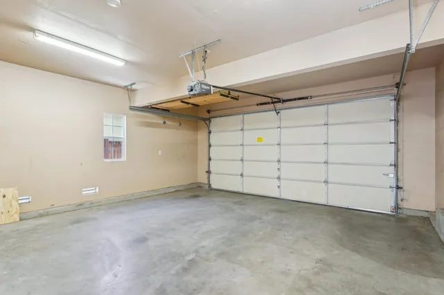 a view of a patio with table and chairs with wooden floor and fence