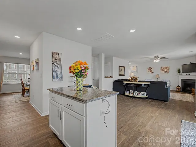 a kitchen with stainless steel appliances a sink and a refrigerator