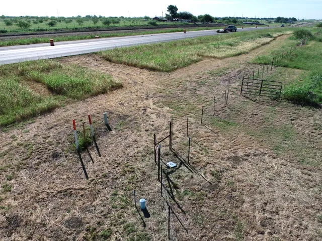 a view of a lake with beach and outdoor space