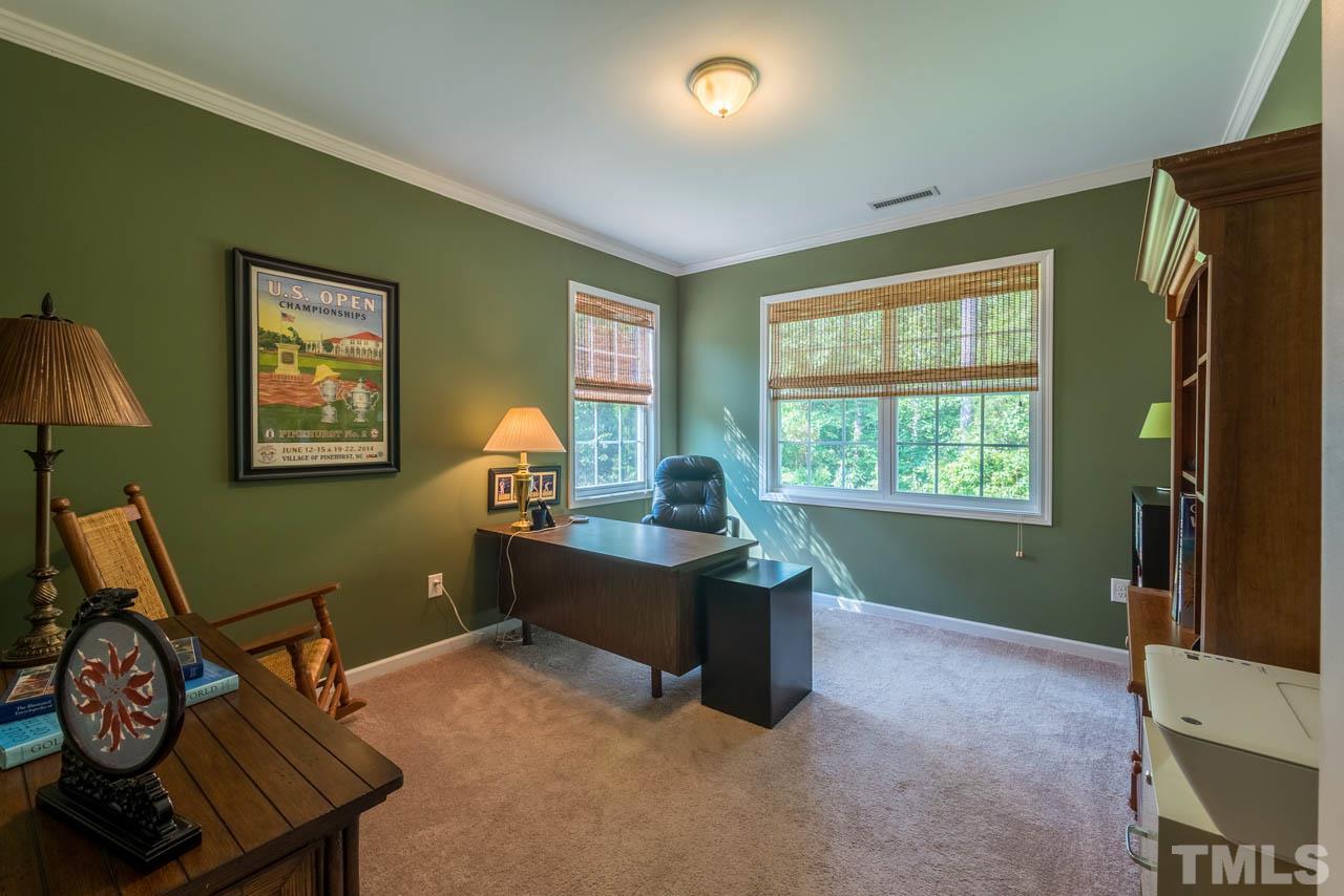 227 Strolling Way Durham, NC 27707 - Photo 12 of 25 a view of a workspace with furniture and a window