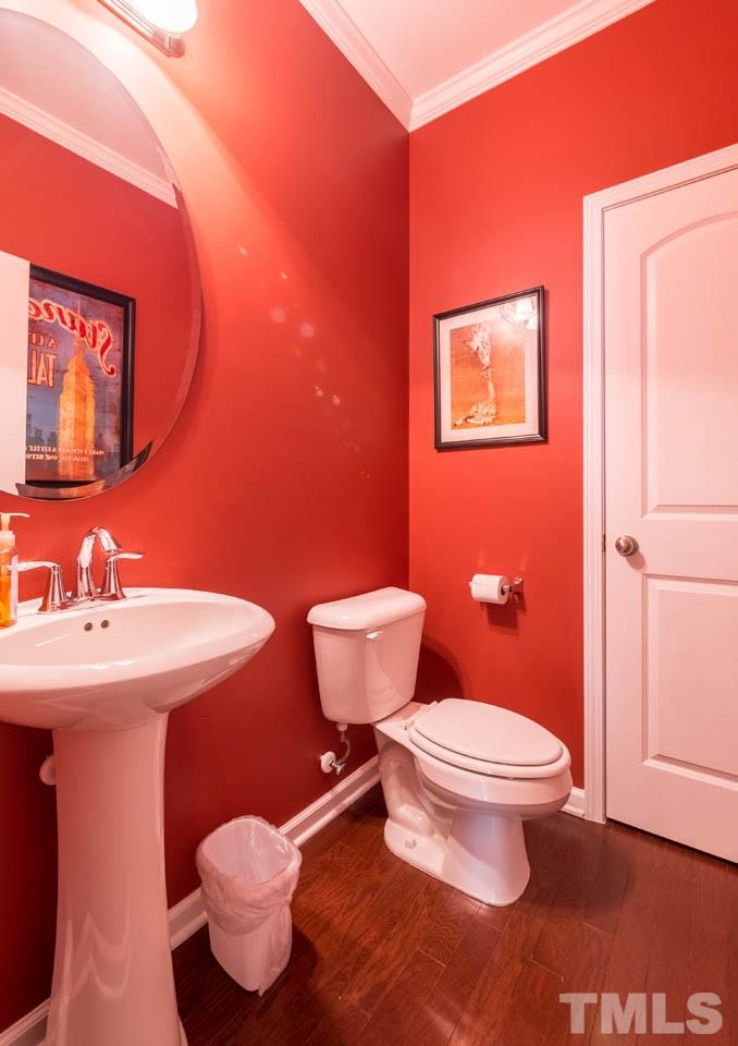 227 Strolling Way Durham, NC 27707 - Photo 13 of 25 a bathroom with a sink and a toilet