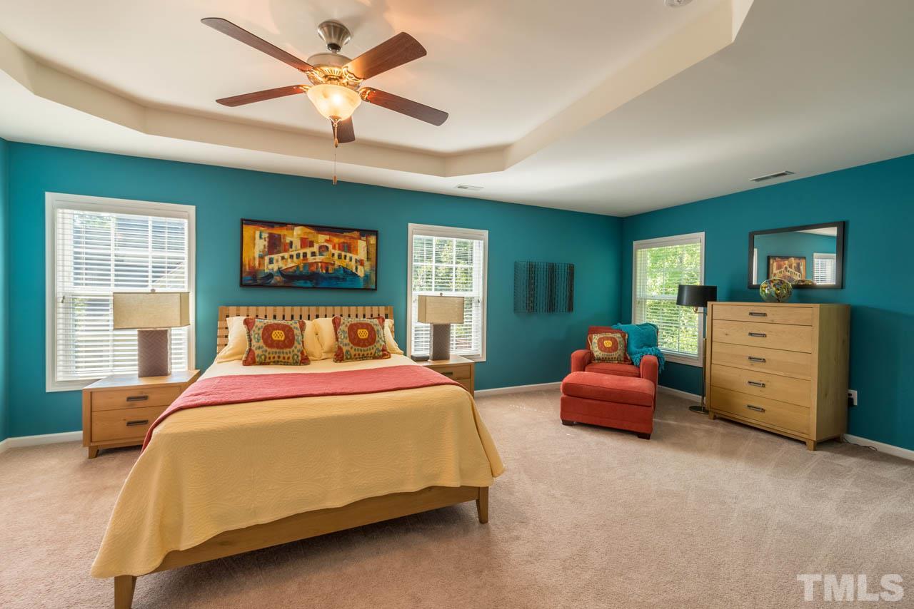 227 Strolling Way Durham, NC 27707 - Photo 14 of 25 a bedroom with bed and window