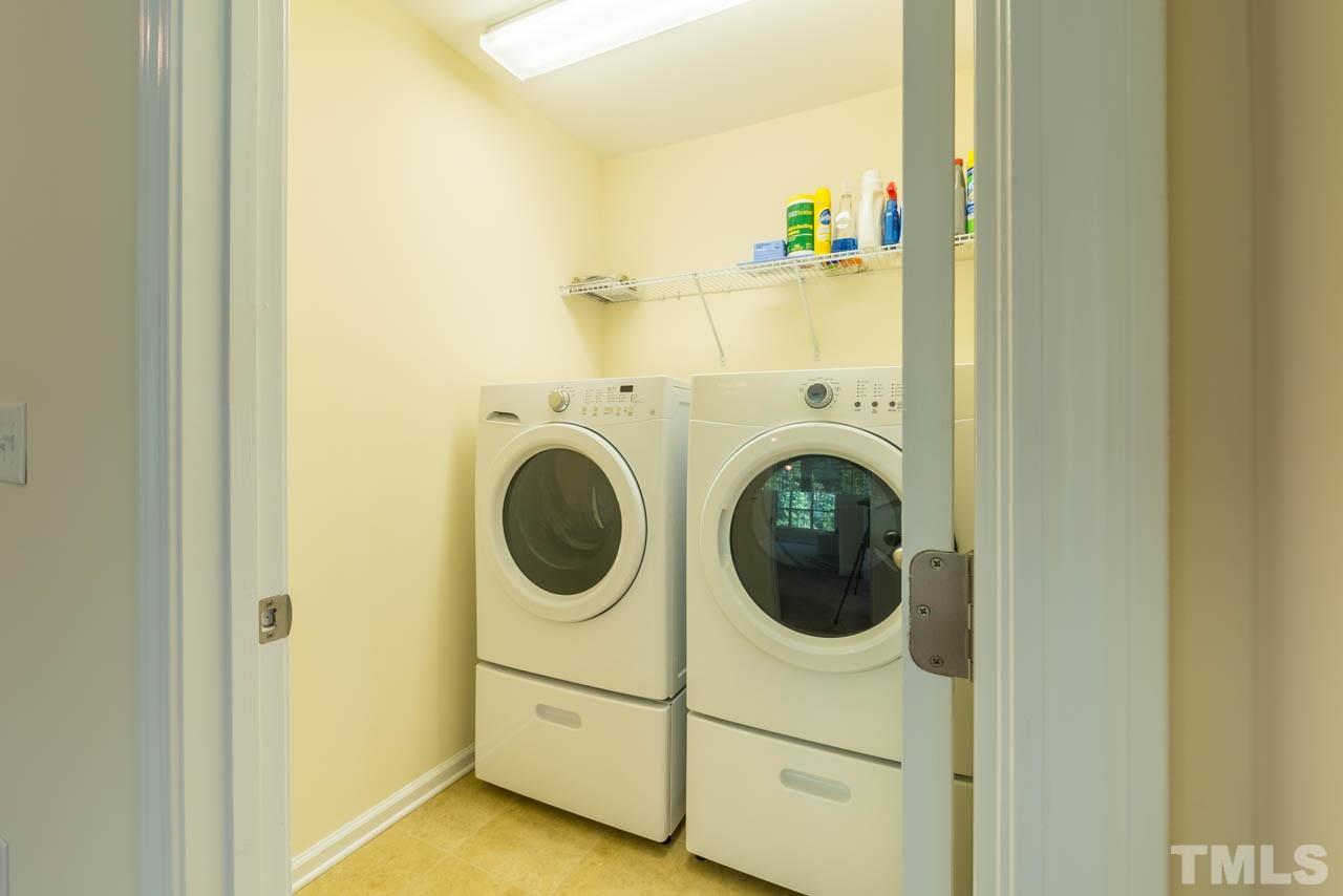 227 Strolling Way Durham, NC 27707 - Photo 22 of 25 a utility room with dryer and washer