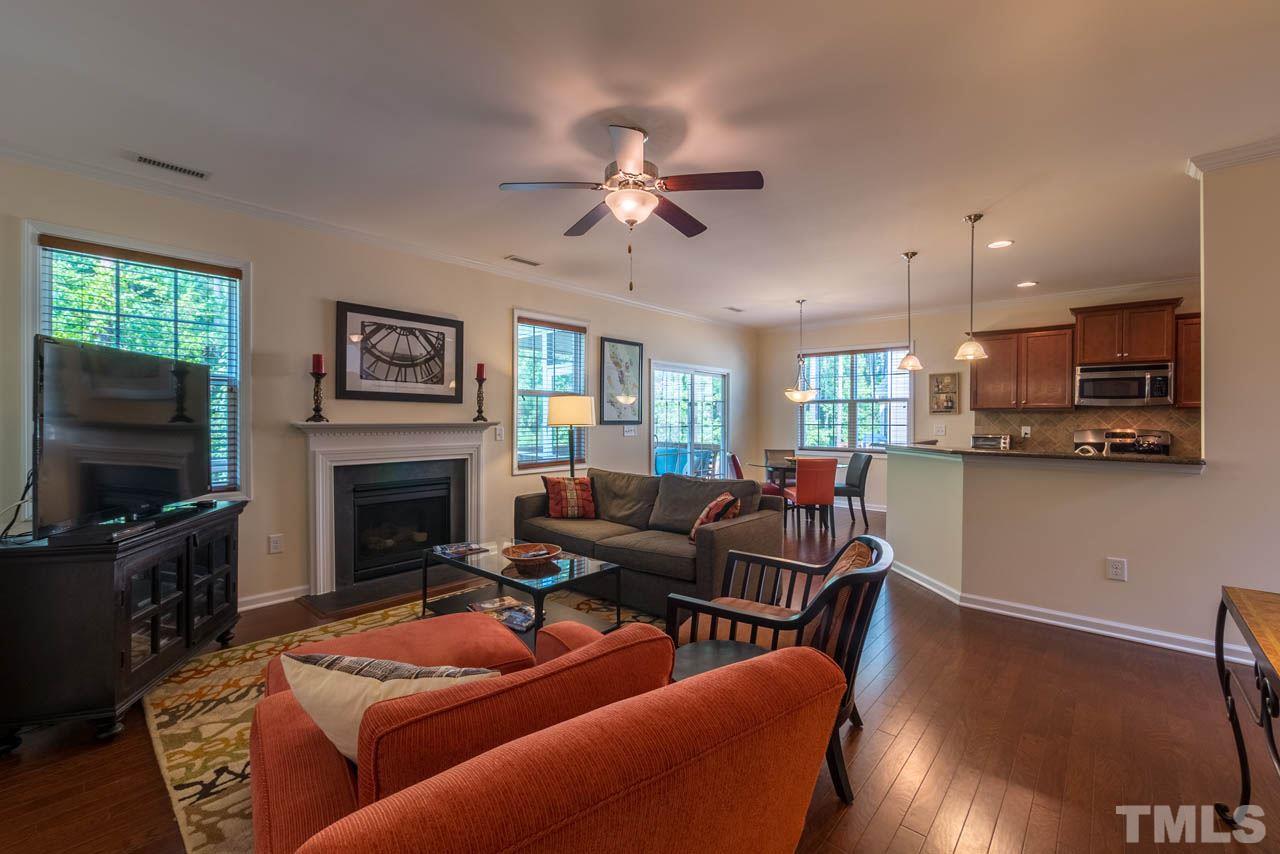 227 Strolling Way Durham, NC 27707 - Photo 6 of 25 a living room with furniture and a flat screen tv