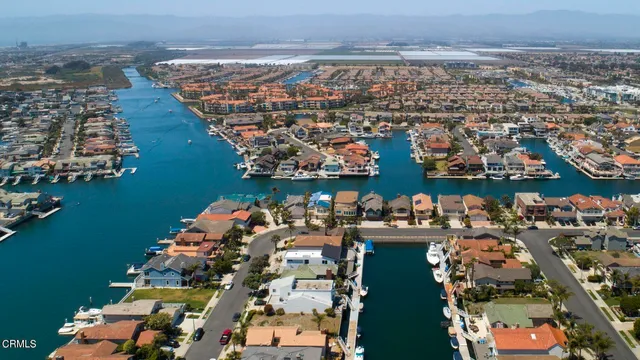 a view of backyard with wooden fence