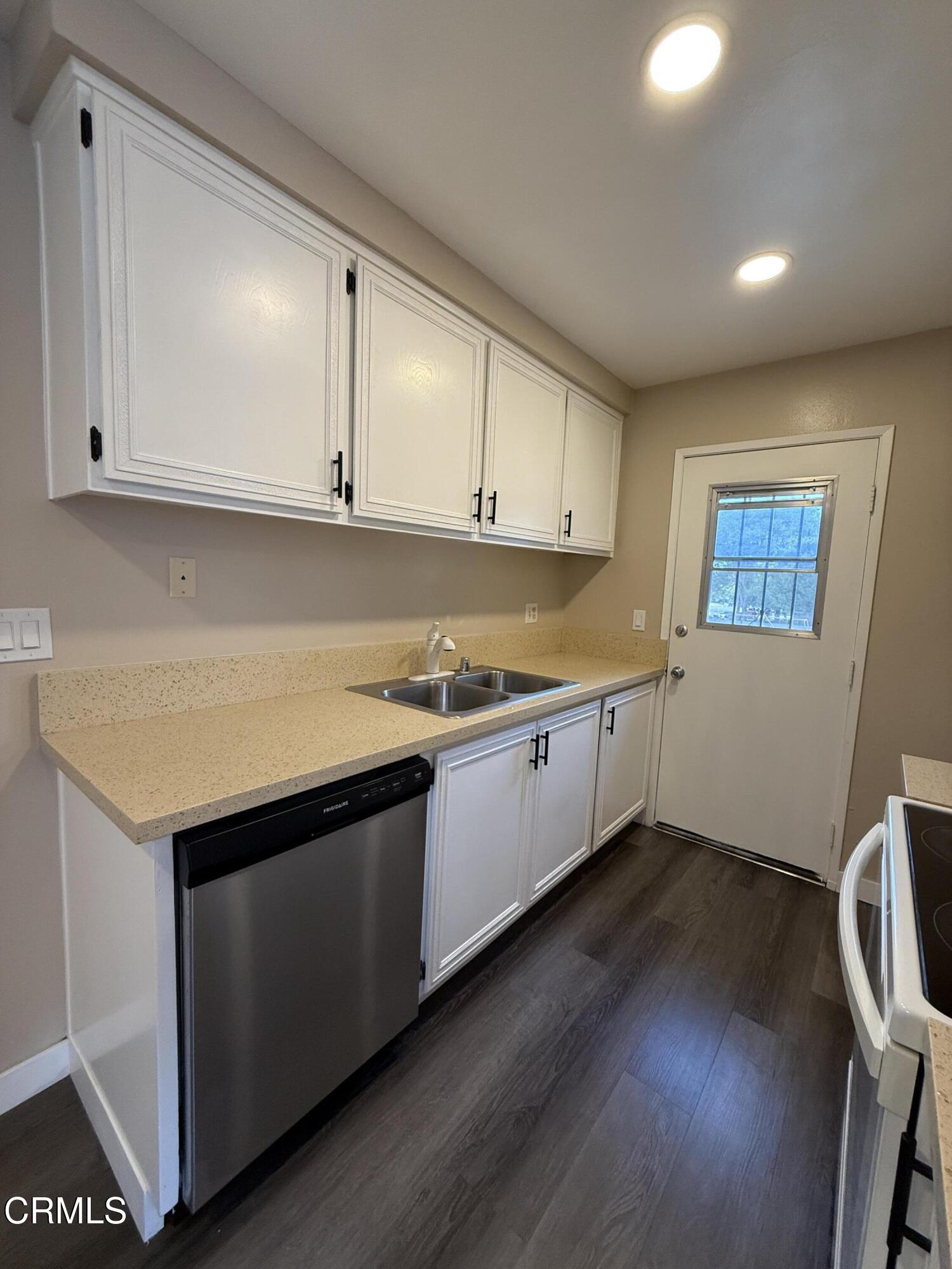 2690 Anchor Avenue Port Hueneme, CA 93041 - Photo 10 of 22 a view of a kitchen with wooden floor and electronic appliances