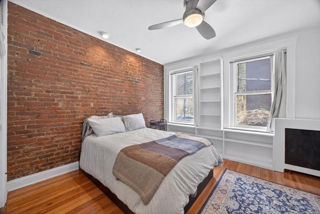 23 Netherlands Road, Unit 1 Brookline, MA 02445 - Photo 11 of 35 a bedroom with a bed and a window