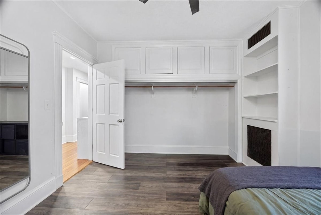 23 Netherlands Road, Unit 1 Brookline, MA 02445 - Photo 15 of 35 a view of bedroom with furniture and fireplace