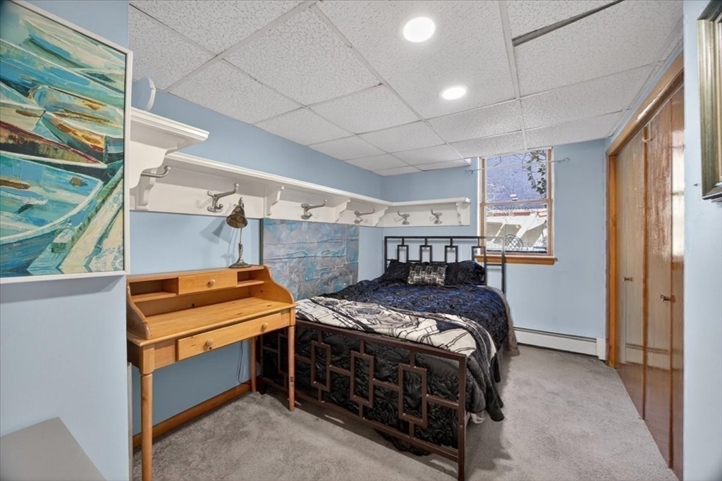 23 Netherlands Road, Unit 1 Brookline, MA 02445 - Photo 26 of 35 a bedroom with a bed and a window