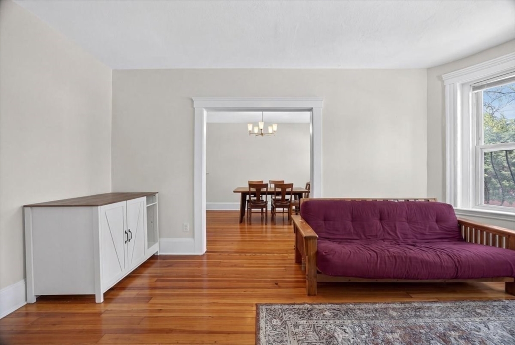 23 Netherlands Road, Unit 1 Brookline, MA 02445 - Photo 6 of 35 a living room with furniture and a window