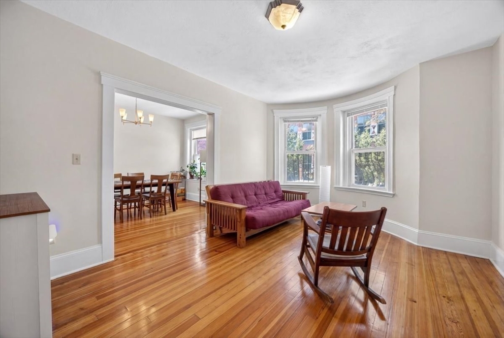 23 Netherlands Road, Unit 1 Brookline, MA 02445 - Photo 7 of 35 a living room with furniture and wooden floor