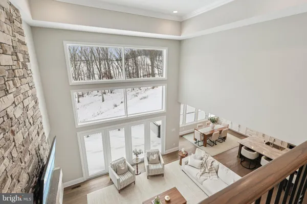 a spacious bedroom with a bed and a chandelier