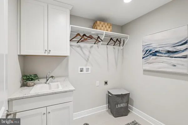 a bathroom with double vanity sinks a large mirror and a shower