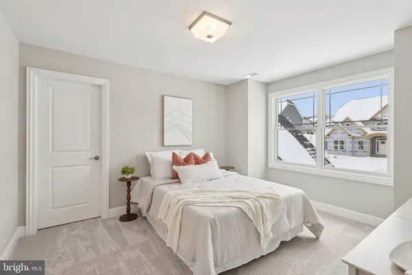 a bedroom with a bed and window