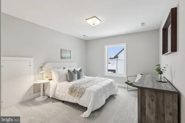 a bed room with a bed and a painting