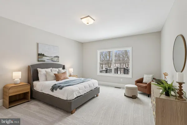 a living room with furniture and white walls
