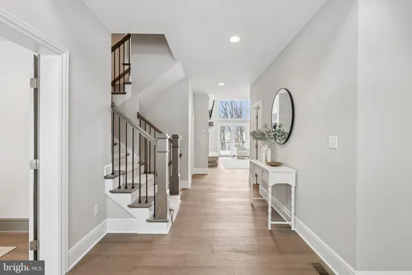a living room with furniture and a white table