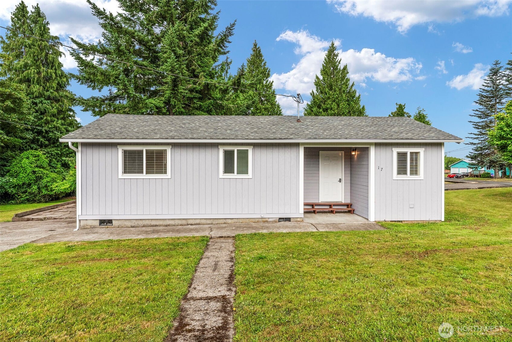 175 Jacobson Road Cathlamet, WA 98612 - Photo 11 of 32 a front view of house with yard and trees
