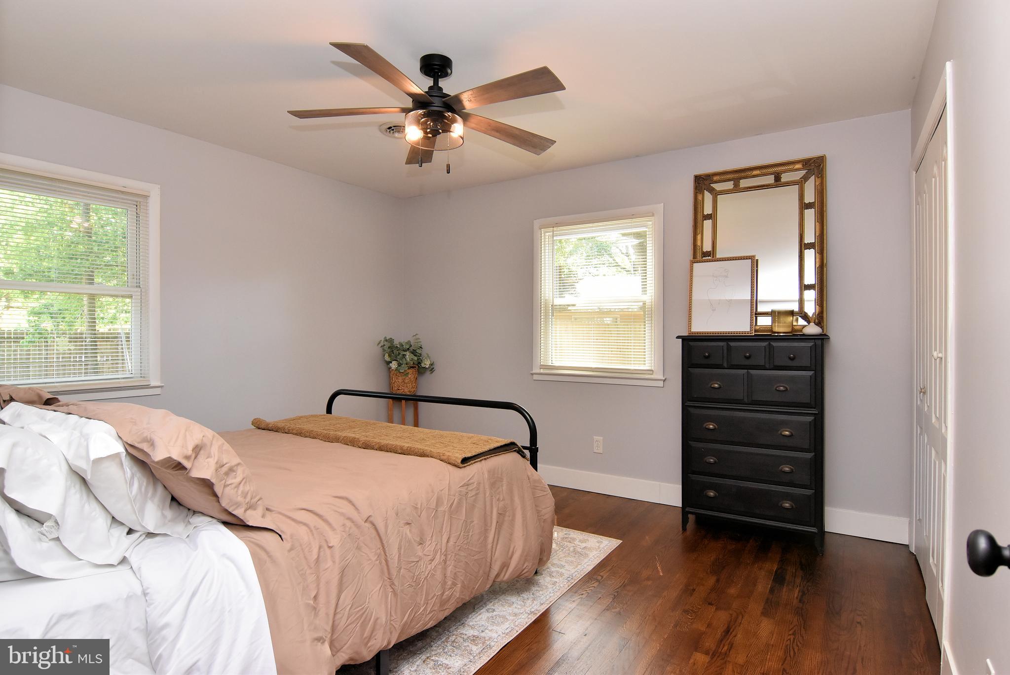9012 Concord Road Seaford, DE 19973 - Photo 20 of 24 a bedroom with a bed a dresser and a window