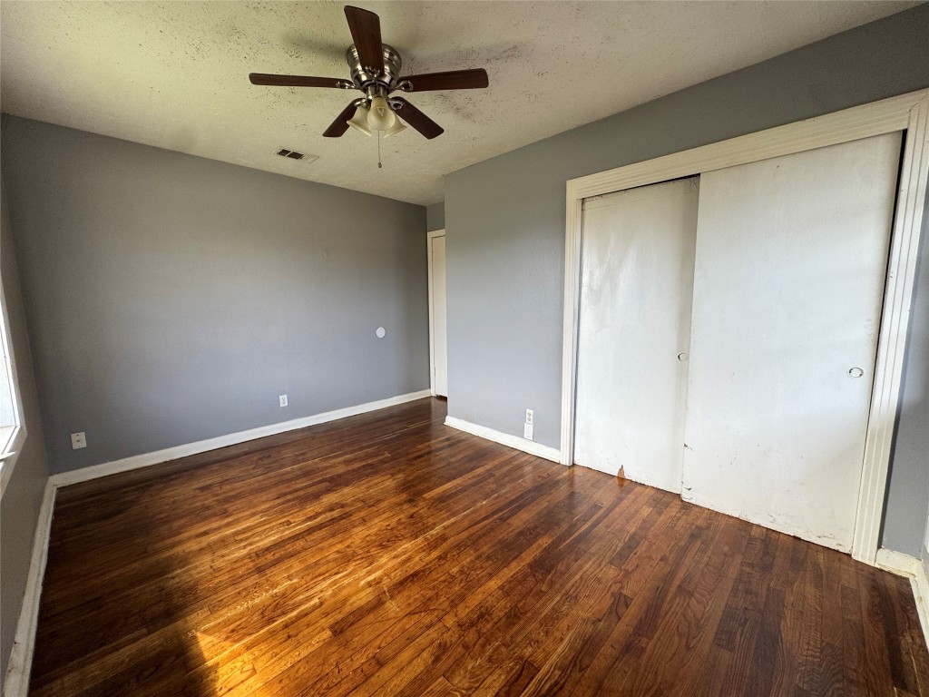 8719 Tilgham Street Houston, TX 77029 - Photo 10 of 11 a view of empty room with wooden floor