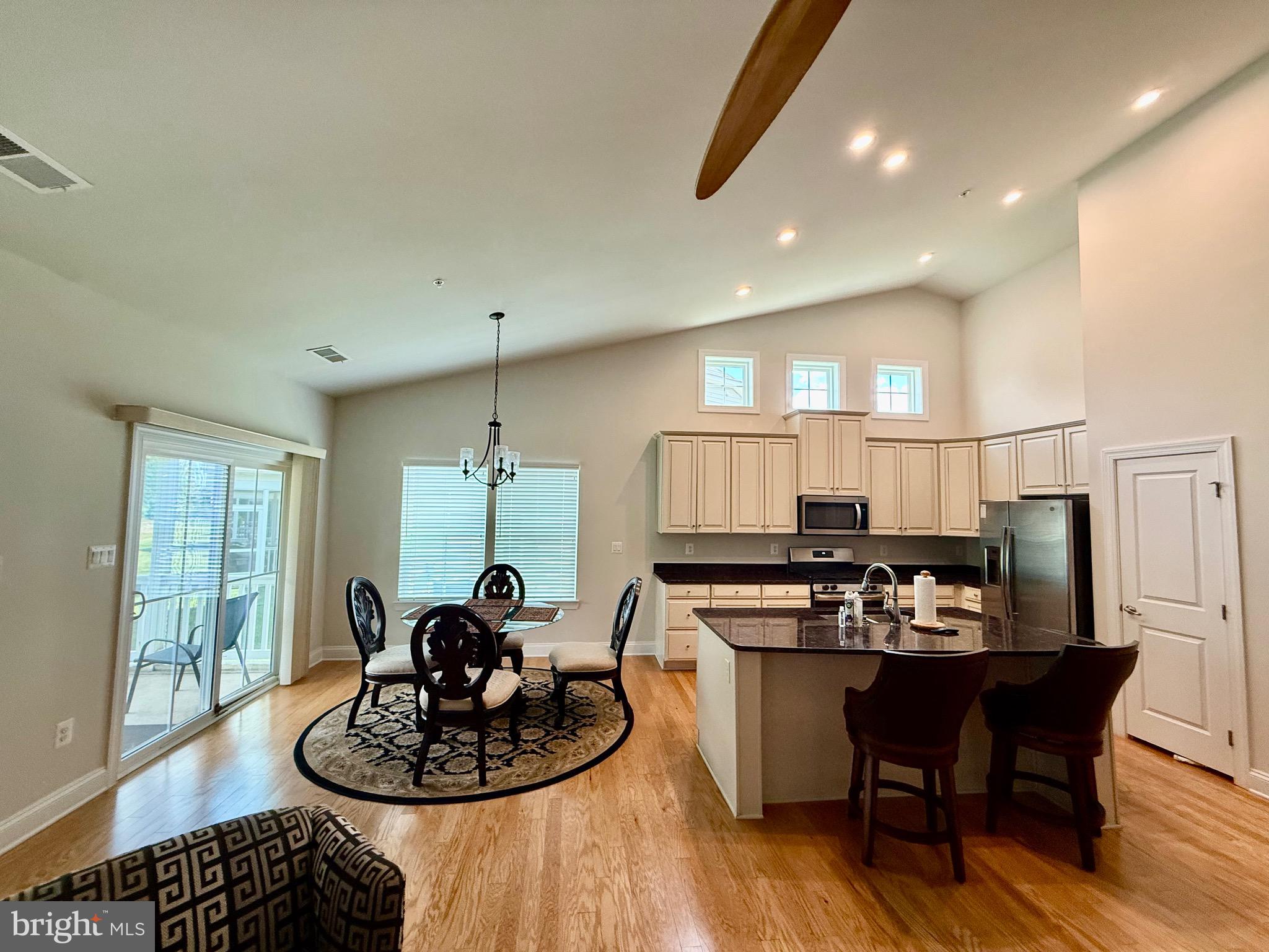 3148 Sunny Ridge Drive Odenton, MD 21113 - Photo 21 of 32 a kitchen with a table and chairs in it