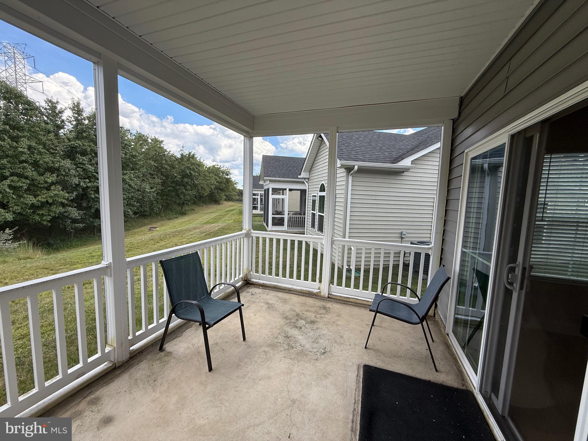 3148 Sunny Ridge Drive Odenton, MD 21113 - Photo 24 of 32 a view of a chair and table in balcony