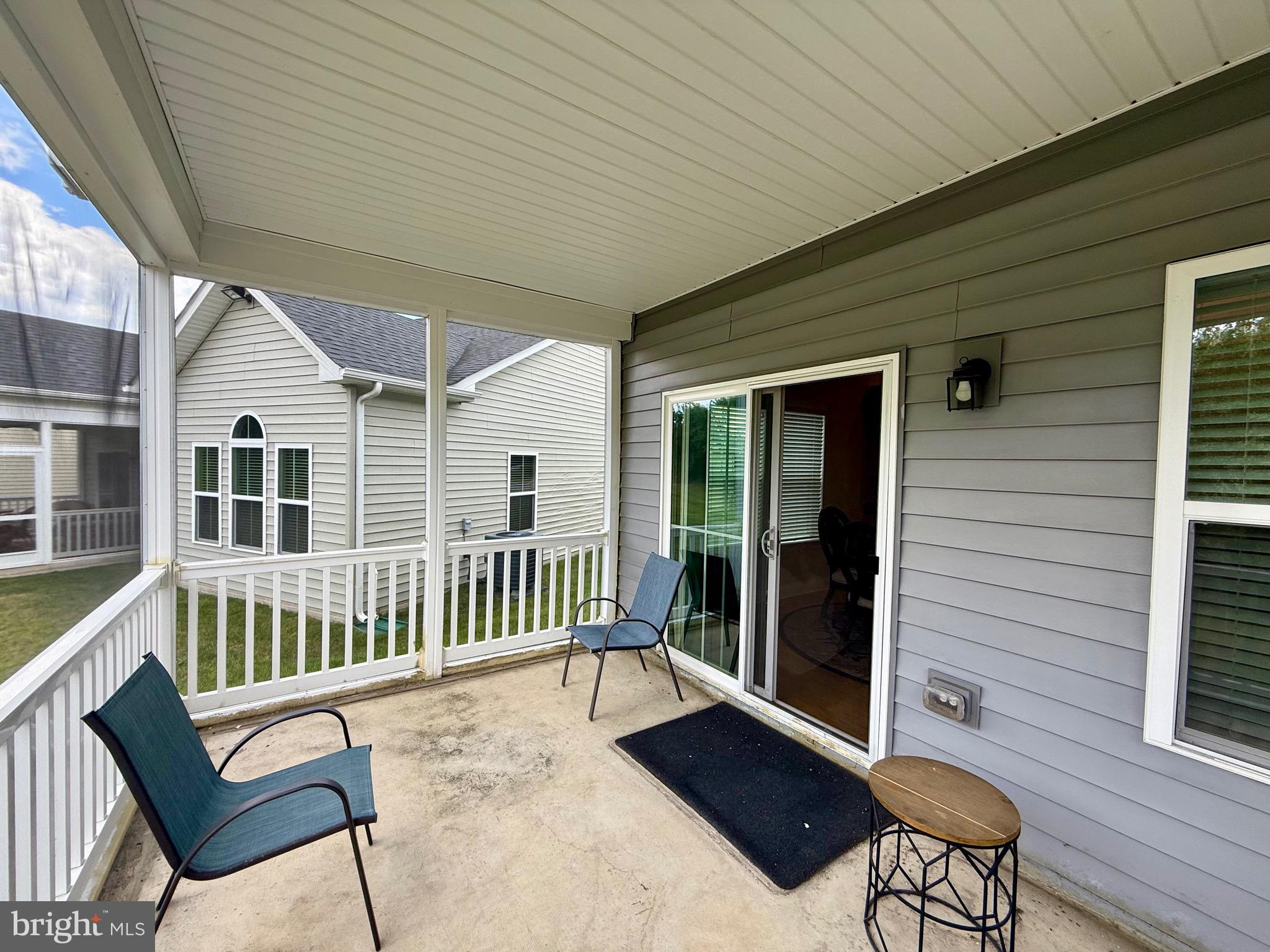3148 Sunny Ridge Drive Odenton, MD 21113 - Photo 25 of 32 a view of a chair and table in the balcony