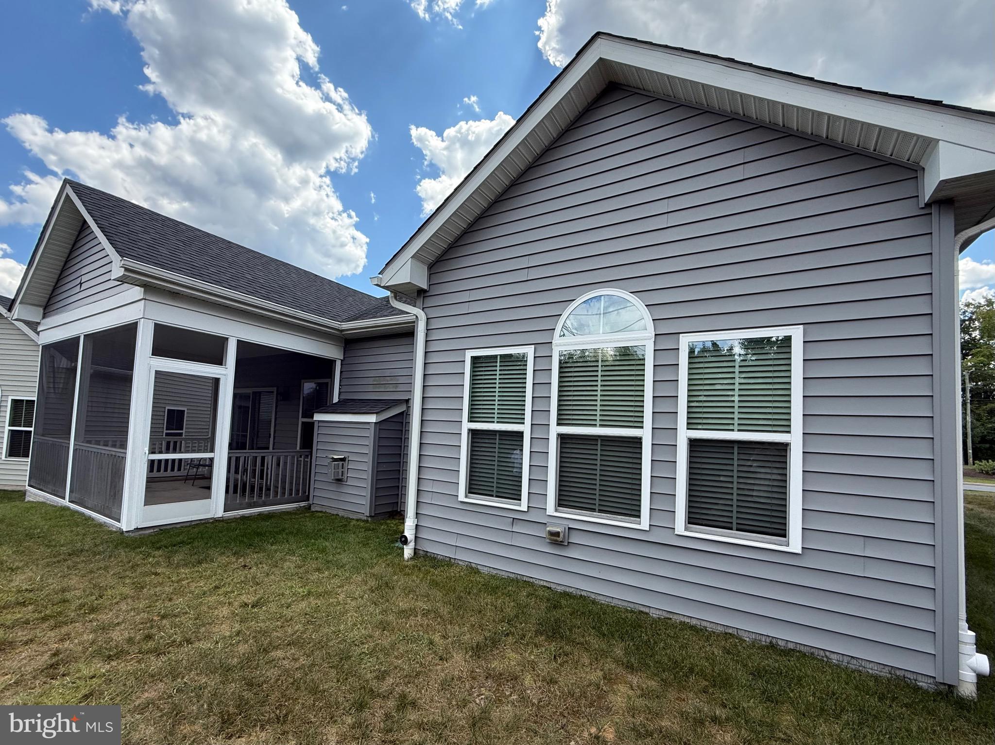 3148 Sunny Ridge Drive Odenton, MD 21113 - Photo 26 of 32 a view of a house with a large window and wooden fence