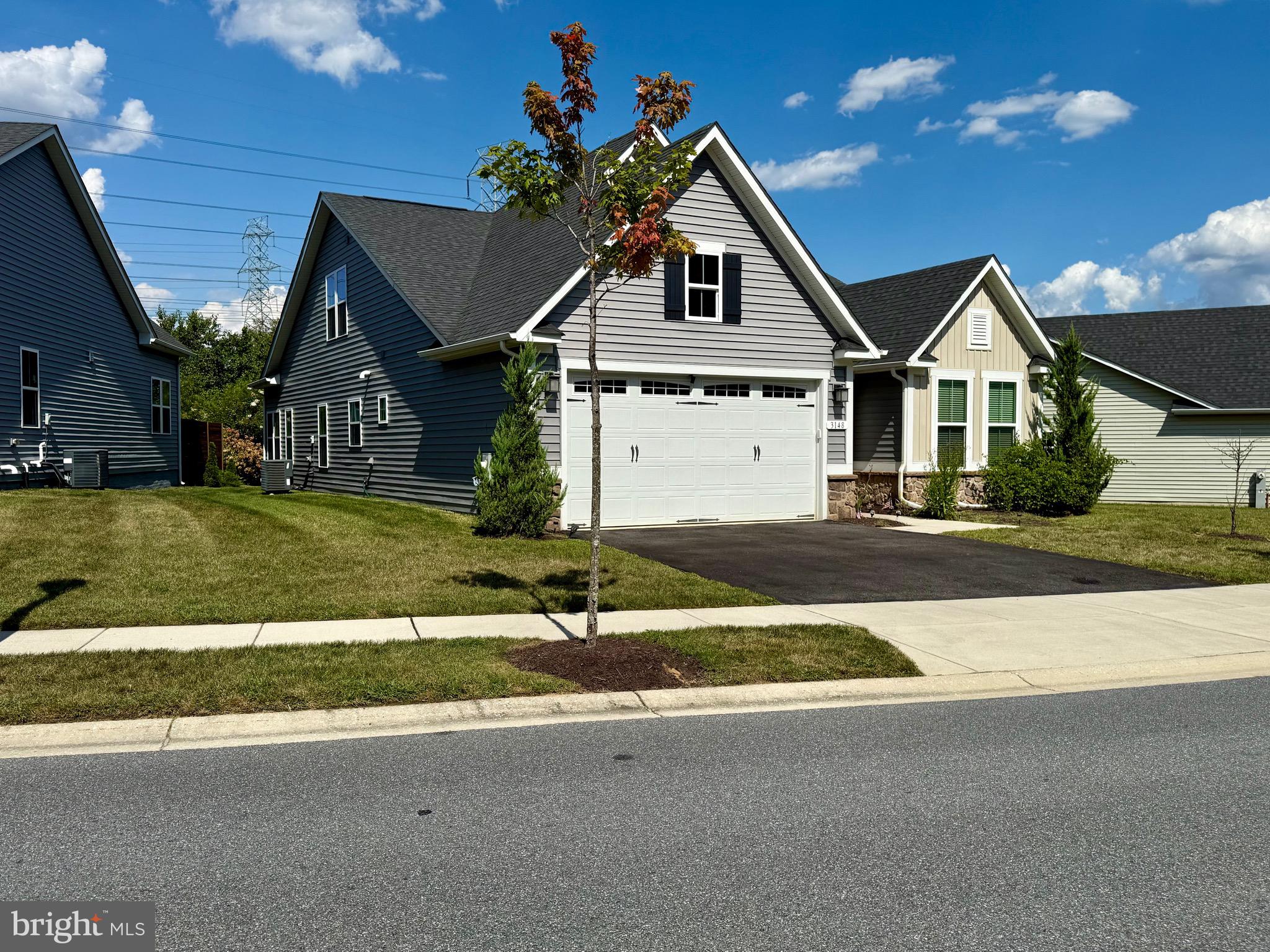 3148 Sunny Ridge Drive Odenton, MD 21113 - Photo 30 of 32 a front view of a house with a yard